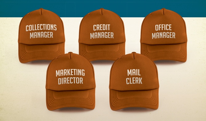 Display of hats with different job titles on them Display of hats with different job titles on them