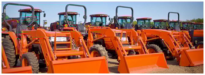 Row of orange tractors Row of orange tractors