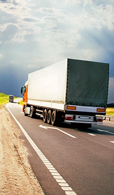 Truck Driving Down Highway